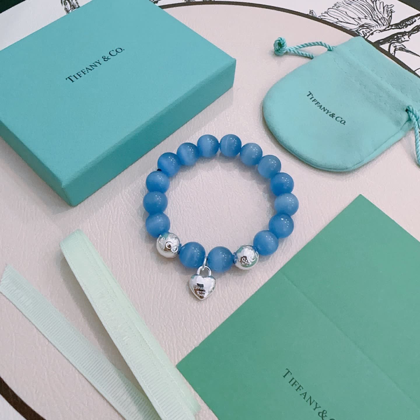 Tiffany & Co. Blue Beaded Bracelet with Lock Charm